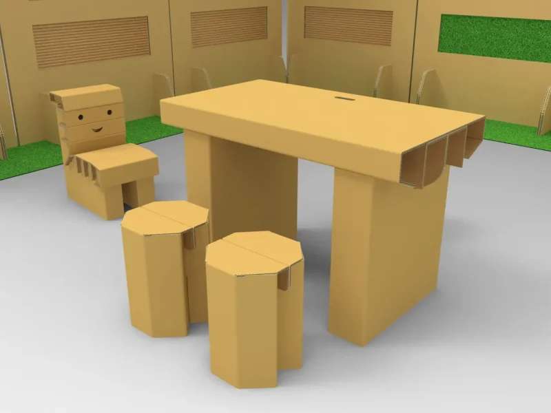 3D render of a cardboard desk, a chair with a smiling face and two octagonal stools inside a cardboard exhibition space with green panels