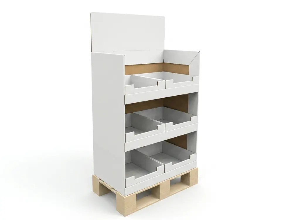 White corrugated pallet display with three tiers of divided trays and a header board on a wooden pallet